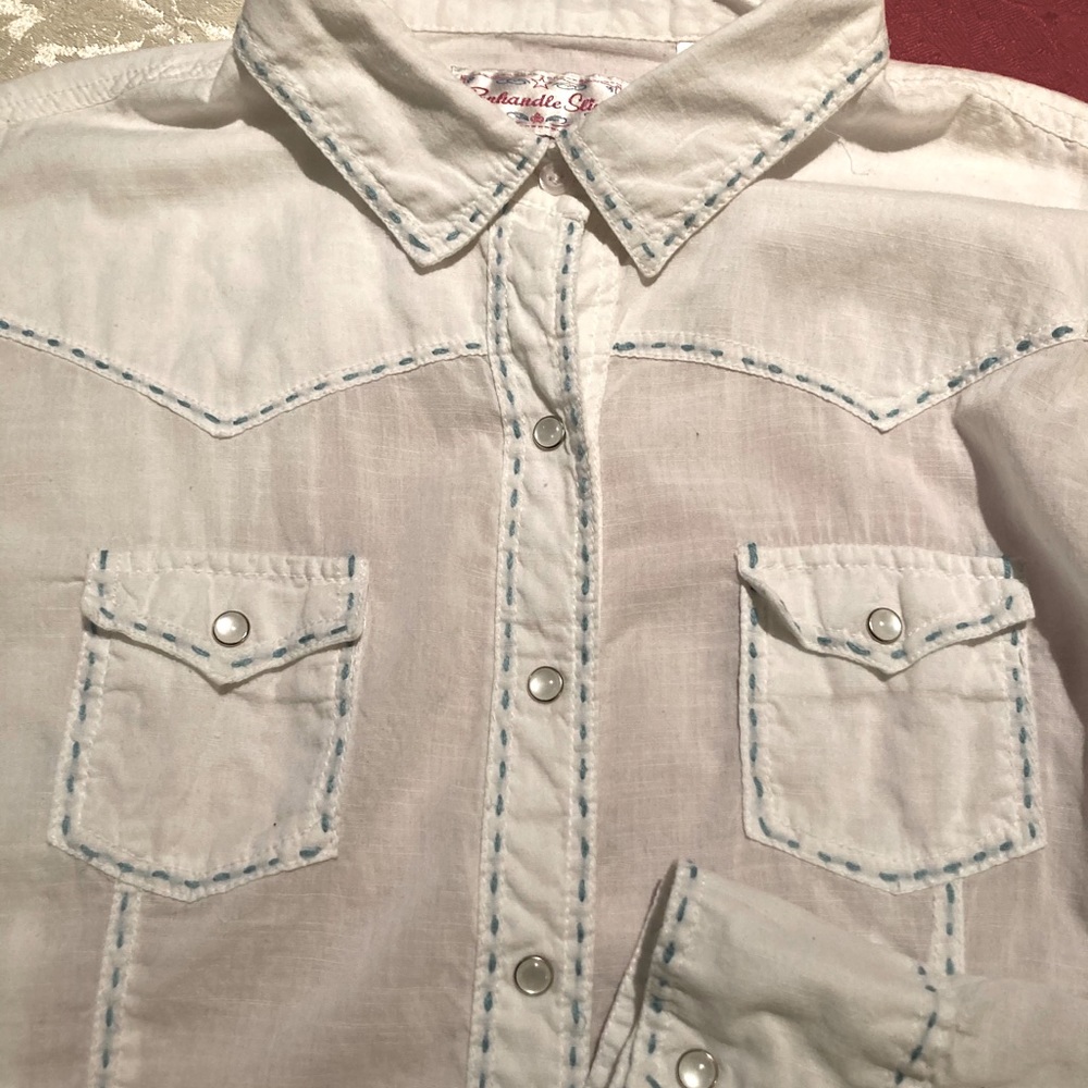 White western shirt with blue stitching.